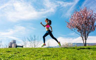 Woman sport running on hill for fitness outdoors