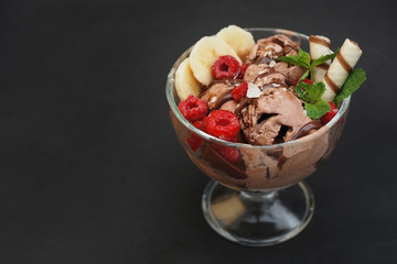 Mixed ice cream in sundae cup on white background