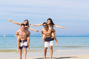 Two Couple On Beach Summer Vacation, Young People Happy Smiling, Man Carry Woman Sea Ocean Holiday Travel