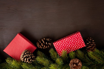 Obraz premium Frames of christmas decoration and gift box with copy space over the wooden background. Xmas and New year cards, invitation, commercial concept