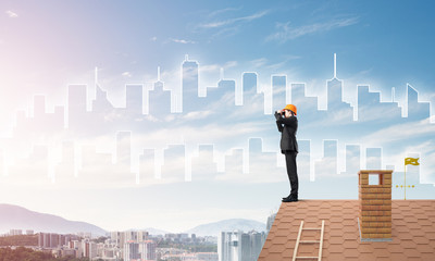 Engineer man standing on roof and looking in binoculars. Mixed media