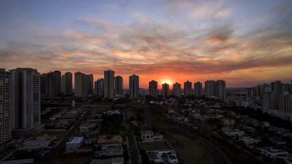 Naklejka na ściany i meble Ribeirao Preto city in Sao Paulo, Brazil. Region of Joao Fiusa Avenue in sunset day.