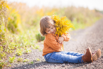 Adorable toddler girl portrait on beautiful autumn day