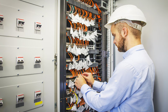 Engineer in server room of datacenter. Networking service. network engineer administrator checking server hardware equipment of data center