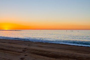 Barceloneta Beach in Barcelona with colorful sky at sunrise