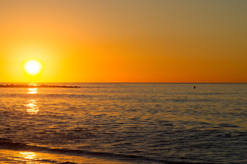 Barceloneta Beach in Barcelona with colorful sky at sunrise