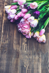 Close up of Bunch of Colorful Tulips on Wooden Background