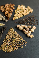 Set of seeds on a black background, vertical, selective focus.