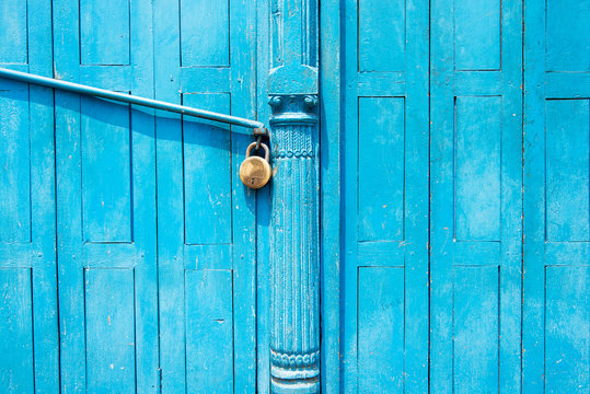 Padlock on a blue door