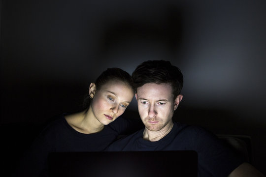 Couple Watching Film On Laptop