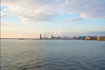 Obraz premium View of the port of Livorno from the seafront at sunset