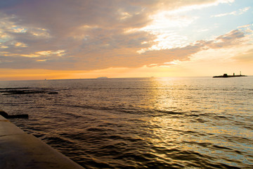 silhouette of submarine sailing in the sea at sunset