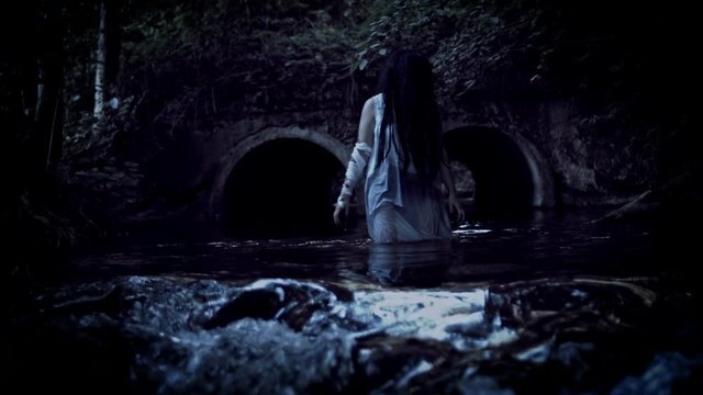 4K Horror Woman Walking to Camera in River