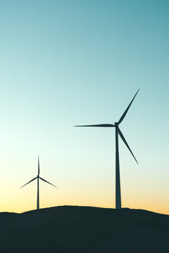 Pair of windmills at sunset