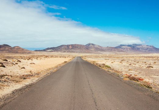 Landscape straight road towards some mountains