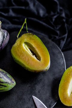 Pear-melons on a wooden  table