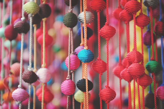 decorative woven beads for sale in a souk in Marrakech, Morocco