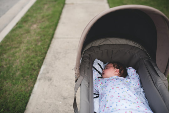 Baby sleeping in a pram