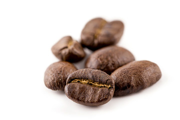 Coffee beans isolated on white background, closeup, macro