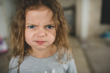 Young girl giving silly faces