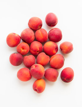 bunch of raspberry aprium on white