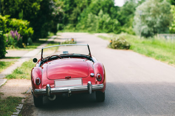 A vintage  car parked on the street