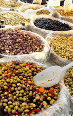 Huge variety of olives for sale on a French market stall