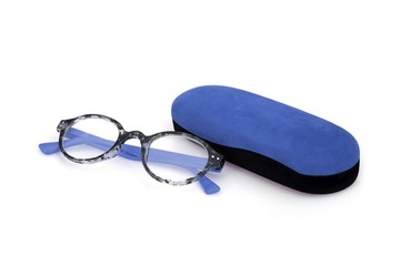 Fashionable plastic glasses in a velvet case on a white background