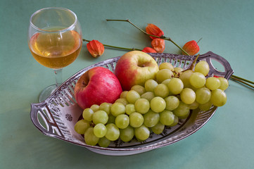 White wine in fine glass and grape