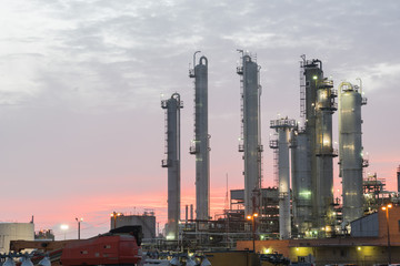 Oil refinery at dramatic sunrise. Oil factory, petrochemical plant in Corpus Christi, Texas, USA....