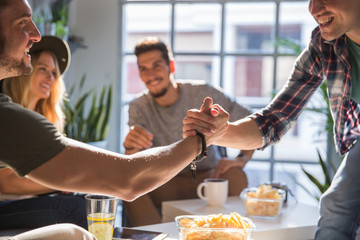 Two friends shaking hands