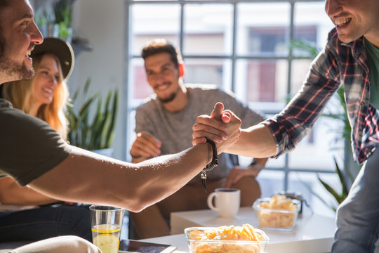 Two friends shaking hands