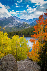 Colorful aspen above bear lake with view of longs peak