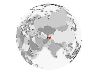 Tajikistan on grey globe isolated