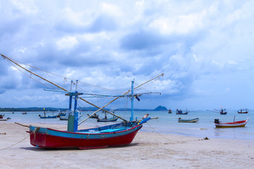  beach Bang Boet Beach with small boat the rain