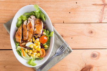 Grilled chicken fillet with colorful salad