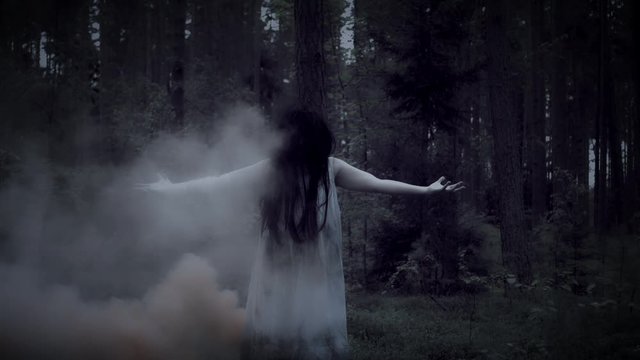 4K Horror Woman Gesturing in Forest with Smoke