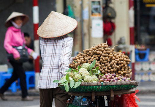 HANOI, VIETNAM - AUGST 2017:  Street vendors selling their goods in Hanoi, Vietnam