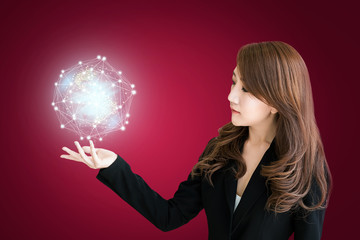 Glowing Global network on Asian business girl hand. Global network business marketing. World wide business concept
