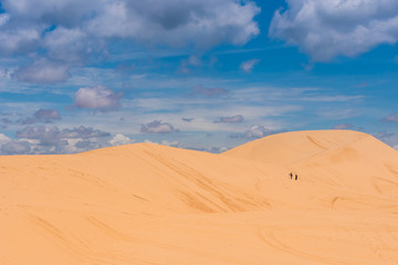 Fototapeta na wymiar Yellow sand dunes in Mui Ne is a popular tourist destination of Vietnam