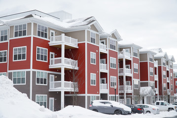 modern apartment building after winter snow storm