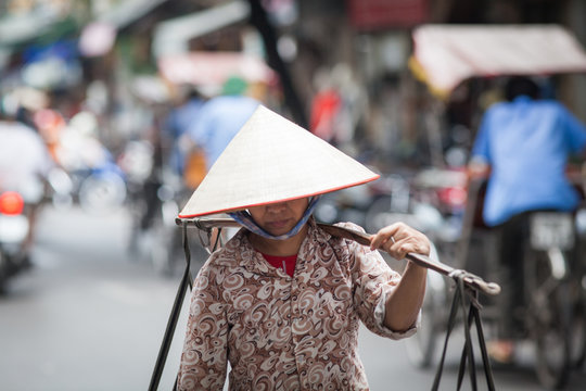 HANOI, VIETNAM - AUGST 2017:  Street vendors selling their goods in Hanoi, Vietnam