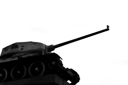 Monument of a Soviet tank with a bird on the barrel