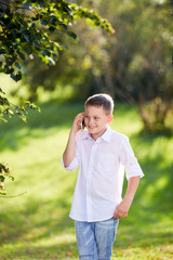 school boy is calling on the smartphone