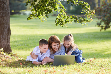 mom and children at the computer. Family at the laptop. 