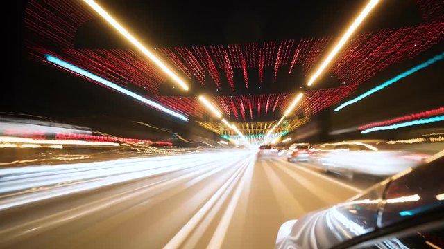 Timelapse. Night ride on car around the city, first-person view.
