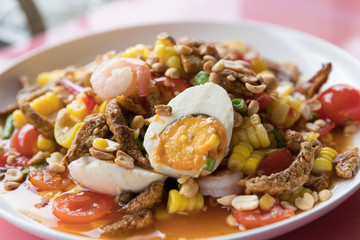 Closeup Thai local street food spicy fruits salad or Som Tam.
