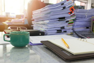 Concept of document workload, Pile of unfinished documents on office desk, Stack of business paper