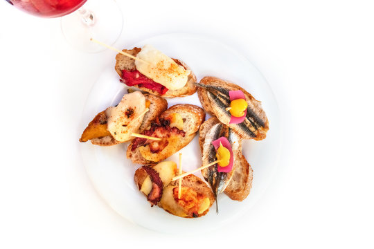 Spanish seafood tapas on a white background