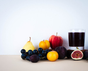 Grape juice with autumn seasonal fruits.